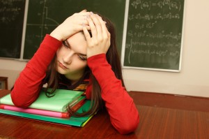 student teen girl beautifyl tired in empty classroom university