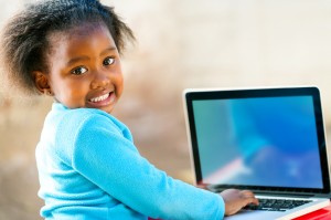 African child learning on computer.